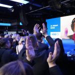 
              Opposition leader Robert Golob addresses members and supporters of the Freedom Movement as they celebrate in Ljubljana, Slovenia, Sunday, April 24, 2022, over a video broadcast, because of positive COVID test. Exit polls in Slovenia's parliamentary vote suggest a strong lead for the opposition liberals over the ruling right-wing populists of Prime Minister Janez Jansa. (AP Photo/Darko Bandic)
            