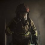 
              A firefighter walks out of an apartment on fire following a Russian bombardment in Kharkiv, Ukraine, Monday, April 25, 2022. (AP Photo/Felipe Dana)
            