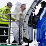 
              Pope Francis, center, uses a boarding lift to board his flight to Malta at Rome's international airport in Fiumicino, Saturday, April 2, 2022. The Pope is on his way to a two-day pastoral visit to Malta. (AP Photo/Alessandra Tarantino)
            