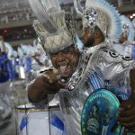 
              A performer from the Beija Flor samba school parades during Carnival celebrations at the Sambadrome in Rio de Janeiro, Brazil, Saturday, April 23, 2022. (AP Photo/Silvia Izquierdo)
            