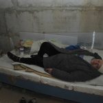 
              A woman lies in a basement of an apartment building in Kharkiv, Ukraine, Sunday, April 10, 2022. (AP Photo/Andrew Marienko)
            