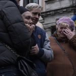 
              The mother of 40-year-old Senior lieutenant, Oliynyk Dmytro, mourns his death during his funeral ceremony, after being killed in action, outside the Holy Apostles Peter and Paul Church, in Lviv, western Ukraine, Saturday, April 2, 2022. (AP Photo/Nariman El-Mofty)
            