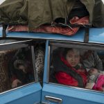 
              Internally displaced people from Mariupol and nearby towns arrive at a refugee center fleeing from the Russian attacks, in Zaporizhzhia, Ukraine, Thursday, April 21, 2022. Mariupol, which is part of the industrial region in eastern Ukraine known as the Donbas, has been a key Russian objective since the Feb. 24 invasion began. (AP Photo/Leo Correa)
            