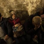 
              People hide in a basement of a church which is used as a bomb shelter after fleeing from nearby villages that have been attacked by the Russian army, in the town of Bashtanka, Mykolaiv district, Ukraine, on Thursday, March 31, 2022. The talks between Ukraine and Russia will resume on Friday as NATO Secretary-General says Russia does not appear to be scaling back its military operations in Ukraine but is instead redeploying forces to the eastern Donbas region. (AP Photo/Petros Giannakouris)
            