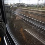 
              Sergei looks out of the window of a train minutes before arriving with his family in Lviv, from Kyiv, Ukraine, Sunday, April 17, 2022. (AP Photo/Rodrigo Abd)
            