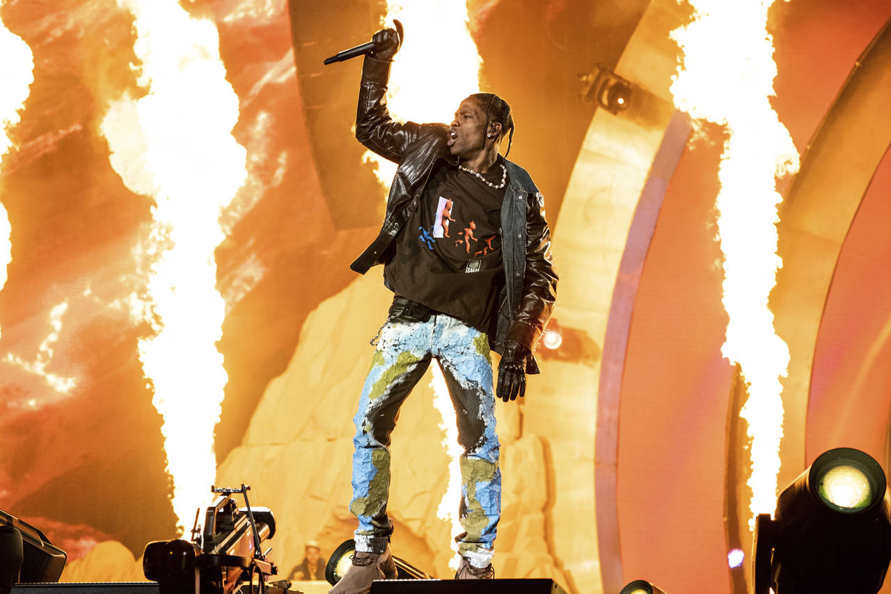 FILE - Travis Scott performs at the Astroworld Music Festival in Houston, Nov. 5, 2021. The experie...