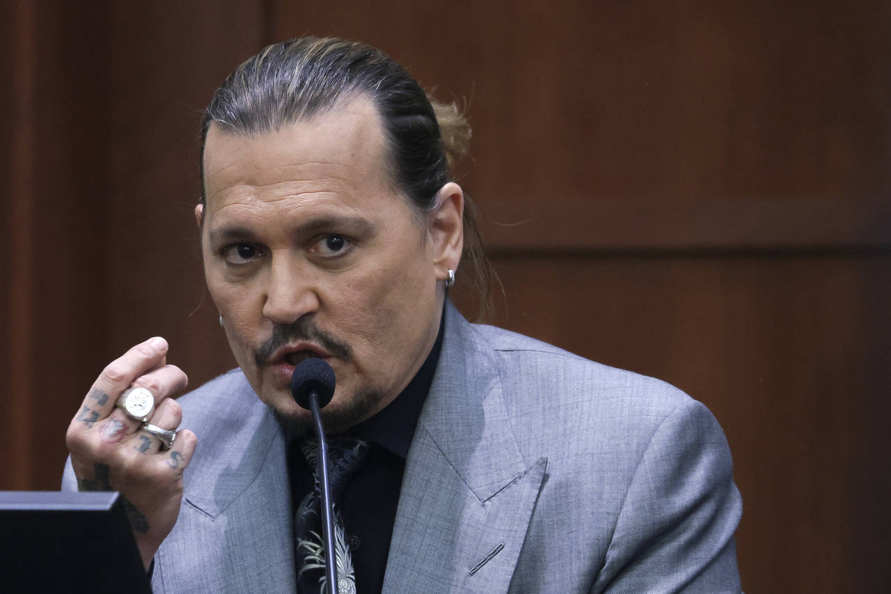 Actor Johnny Depp testifies during a hearing in the courtroom at the Fairfax County Circuit Court i...