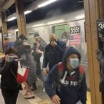 
              In this photo from social media video, passengers run from a subway car in a station in the Brooklyn borough of New York, Tuesday, April 12, 2022. A gunman filled a rush-hour subway train with smoke and shot multiple people Tuesday, leaving wounded commuters bleeding on a Brooklyn platform as others ran screaming, authorities said. Police were still searching for the suspect. (Will B Wylde via AP)
            