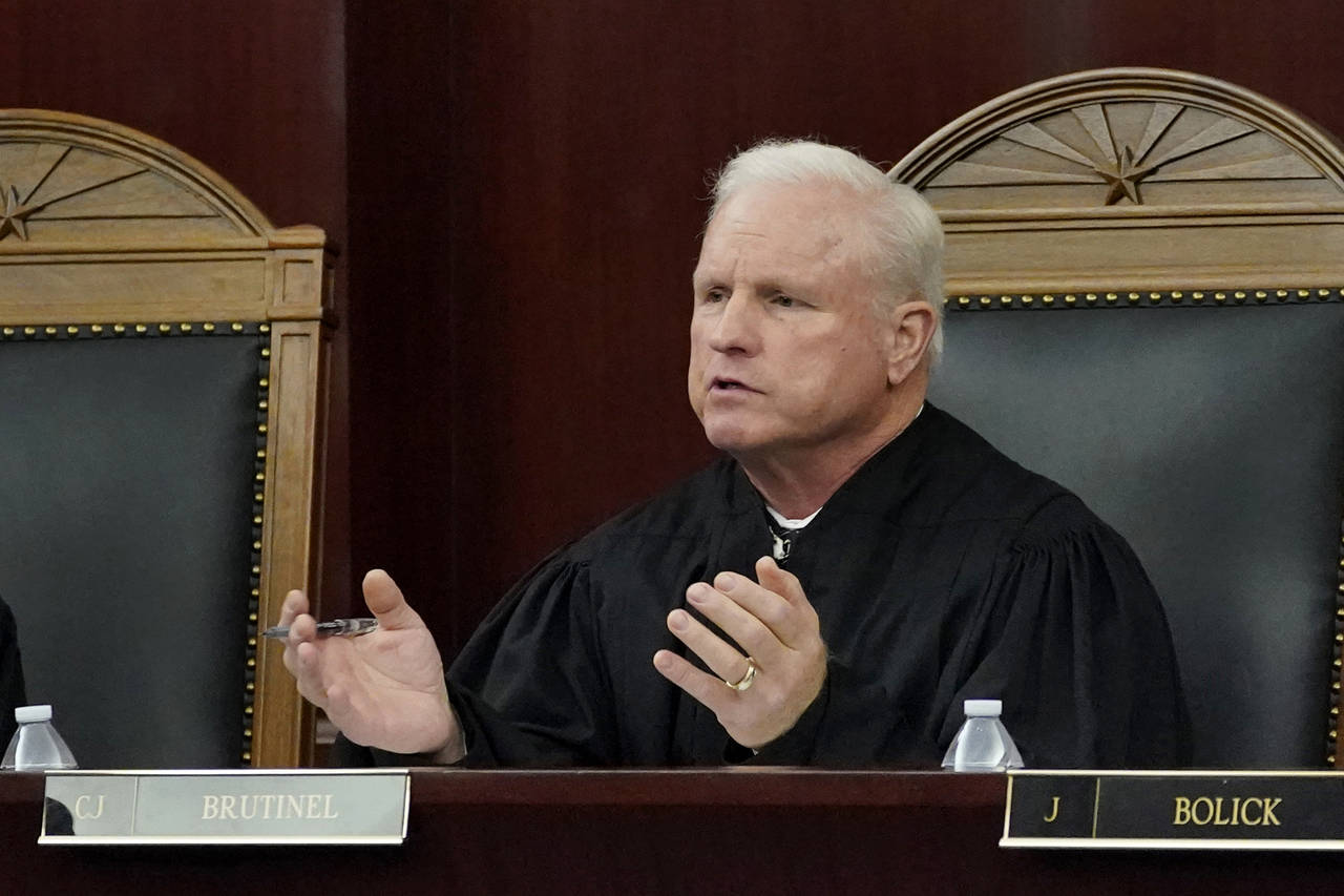 FILE - Arizona Supreme Court Chief Justice Robert M. Brutinel speaks during oral arguments, in Phoe...