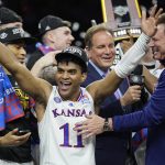 
              Kansas guard Remy Martin celebrates after their win against North Carolina in a college basketball game at the finals of the Men's Final Four NCAA tournament, Monday, April 4, 2022, in New Orleans. (AP Photo/David J. Phillip)
            