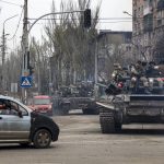 
              Russian tanks roll along a street in an area controlled by Russian-backed separatist forces in Mariupol, Ukraine, Saturday, April 23, 2022. (AP Photo/Alexei Alexandrov)
            