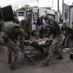 
              Ukrainian military medics move an injured Ukrainian serviceman to a hospital in Donetsk region, eastern Ukraine, Saturday, April 23, 2022. (AP Photo/Evgeniy Maloletka)
            