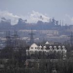 
              FILE - A metallurgical plant is seen on the outskirts of the city of Mariupol, Ukraine, Thursday, Feb. 24, 2022. Russia began evacuating its embassy in Kyiv, and Ukraine urged its citizens to leave Russia. Unbroken by a Russian blockade and relentless bombardment, the key port of Mariupol is still holding out, a symbol of staunch Ukrainian resistance that has thwarted the Kremlin's invasion plans. (AP Photo/Sergei Grits, File)
            