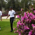 
              Fred Couples, left, walks with Tiger Woods to the 14th tee during a practice round for the Masters golf tournament on Wednesday, April 6, 2022, in Augusta, Ga. (AP Photo/Charlie Riedel)
            