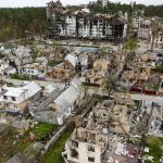 
              Destroyed houses are photographed in Irpin, on the outskirts of Kyiv, Ukraine, Saturday, April 30, 2022. (AP Photo/Emilio Morenatti)
            