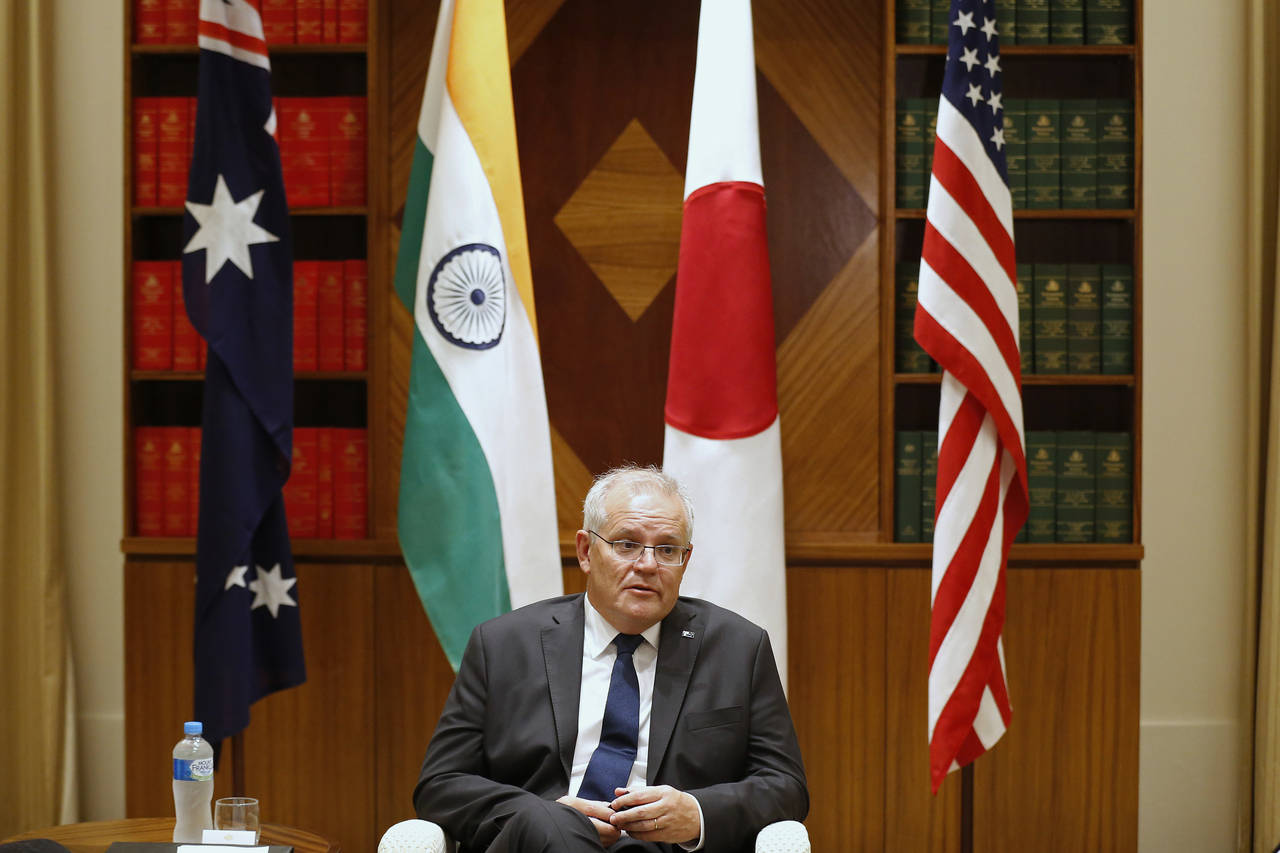 FILE - Australian Prime Minister Scott Morrison speaks to the media during a meeting with Quad memb...