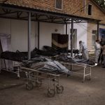 
              Dead bodies wait to be identified outside a morgue in Bucha, on the outskirts of Kyiv, Monday, April 25, 2022. (AP Photo/Emilio Morenatti)
            
