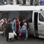 
              People board a transport during evacuation of civilians in Kramatorsk, Ukraine, Tuesday, April 12, 2022. (AP Photo/Andriy Andriyenko)
            
