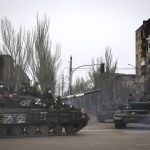 
              Russian military vehicles move in an area controlled by Russian-backed separatist forces in Mariupol, Ukraine, Saturday, April 23, 2022. (AP Photo/Alexei Alexandrov)
            