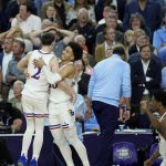 
              Kansas forward Jalen Wilson and Christian Braun (2) celebrate against North Carolina during the second half of a college basketball game in the finals of the Men's Final Four NCAA tournament, Monday, April 4, 2022, in New Orleans. (AP Photo/Gerald Herbert)
            