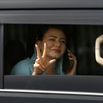 
              Maiza Hameed, an opposition lawmaker flashed victory sign as she arrives to attend the National Assembly session in Islamabad, Pakistan, Monday, April 11, 2022. Pakistani lawmakers are to choose a new prime minister on Monday, capping a tumultuous week of political drama that saw the ouster of Imran Khan as premier and a constitutional crisis narrowly averted after the country's top court stepped in. (AP Photo/Anjum Naveed)
            