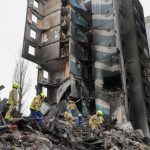 
              Emergency workers shift the rubble from a multi-storey building destroyed in a Russian attack, at the beginning of the Russia-Ukraine war in Borodyanka, close to Kyiv, Ukraine, Saturday, April 9, 2022.  (AP Photo/Efrem Lukatsky)
            