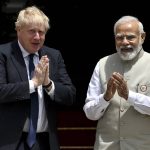 
              Britain's Prime Minister Boris Johnson, left, and his Indian counterpart Narendra Modi gesture before their meeting at Hyderabad House in New Delhi Friday, April 22, 2022. (Ben Stansall/Pool Photo via AP)
            