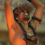 
              A performer from the Beija Flor samba school parades during Carnival celebrations at the Sambadrome in Rio de Janeiro, Brazil, Saturday, April 23, 2022. (AP Photo/Silvia Izquierdo)
            