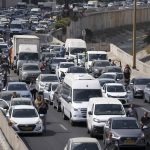 
              Israelis stand still next to their cars on a freeway as a two-minute siren sounds in memory of victims of the Holocaust in Tel Aviv, Israel, Thursday, April 28, 2022. Holocaust remembrance day is one of the most solemn on Israel's calendar with restaurants and places of entertainment shut down, and radio and TV programming focused on Holocaust documentaries and interviews with survivors. (AP Photo/Ariel Schalit)
            