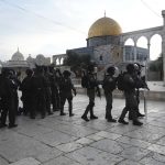 
              Israeli police deploy in the Al Aqsa Mosque compound in Jerusalem's Old City, Friday, April 22, 2022. Israeli police and Palestinian youths clashed again at the major Jerusalem holy site sacred to Jews and Muslims on Friday despite a temporary halt to Jewish visits to the site, which are seen as a provocation by the Palestinians. (AP Photo/Mahmoud Illean)
            
