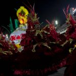 
              A performer from the Viradouro samba school parades during Carnival celebrations at the Sambadrome in Rio de Janeiro, Brazil, Saturday, April 23, 2022. (AP Photo/Bruna Prado)
            