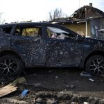 
              A car riddled with bullet holes due to the war with Russia is seen in Bucha, in the outskirts of Kyiv, Ukraine, Monday, April 11, 2022. (AP Photo/Rodrigo Abd)
            