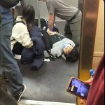 
              FILE — In this photo provided by Will B Wylde, a person is aided in a subway car after an attack, in the Brooklyn borough of New York, April 12, 2022. The shooting victims ranged in age from 16 to 60. Most of the wounds were to the legs, back and buttocks. (Will B Wylde via AP, File)
            