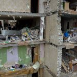 
              Firefighters work inside a building destroyed by a Russian bomb in Chernihiv on Friday, April 22, 2022. (AP Photo/Emilio Morenatti)
            