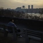 
              Adam Almonte sits on a bench overlooking the Hudson River where he used to sit and eat tuna sandwiches with his older brother, Fernando Morales, in Fort Tryon Park in New York, Wednesday, March 16, 2022. On the deadliest day of a horrific week in April 2020, COVID-19 took the lives of 816 people in New York City alone. Lost in the blizzard of pandemic data that's been swirling ever since is the fact that 43-year-old Morales was one of them. Soon, likely in the next few weeks, the U.S. toll from the coronavirus will surpass 1 million. (AP Photo/David Goldman)
            