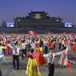 
              People dance in the celebration of the birth anniversary of late state founder Kim Il Sung, at the Kim Il Sung Square in Pyongyang, North Korea, Friday, April 15, 2022. (Kyodo News via AP)
            
