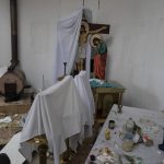 
              A wooden crucifix is half covered with a white sheet inside a damaged church following a Russian attack in the previous weeks in the town of Makarov , Kyiv region Ukraine, on Sunday, April 10, 2022. Since the beginning of the war at least 59 spiritual sites, most are Orthodox churches have been ruined or damaged, the Ukrainian authorities said. (AP Photo/Petros Giannakouris)
            