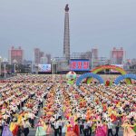 
              People dance in the celebration of the birth anniversary of late state founder Kim Il Sung, at the Kim Il Sung Square in Pyongyang, North Korea, Friday, April 15, 2022. (Kyodo News via AP)
            