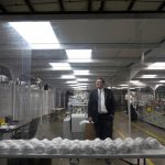 
              Jim Schmersahl, owner of Halcyon Shades, poses in a "clean room" used in making N-95 masks at the company's production facility Friday, March 18, 2022, in University City, Mo. Halcyon is small company that normally makes window shades, but when the pandemic hit, its sales plummeted. Halcyon applied for the state grants to make PPE as a way to try to keep its employees at work and keep the company afloat. (AP Photo/Jeff Roberson)
            
