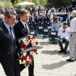 
              Richard Lutz CEO of Deutsche Bahn, and Kai Diekmann German journalist, pay tribute during a wreath-laying ceremony marking Holocaust Remembrance Day at Warsaw Ghetto Square at the Yad Vashem memorial in Jerusalem, Thursday, April 28, 2022. (Amir Cohen/Pool Photo via AP)
            