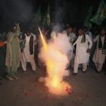 
              Supporters of Pakistani opposition party hold firework to celebrate following the Supreme Court decision, in Peshawar, Pakistan, Thursday, April 7, 2022. Pakistan's Supreme Court on Thursday blocked Prime Minister Imran Khan's bid to stay in power, ruling that his move to dissolve Parliament and call early elections was illegal. That set the stage for a no-confidence vote by opposition lawmakers, who say they have enough support to oust him. (AP Photo/Muhammad Sajjad)
            