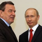 
              FILE-In this April 14, 2009 file photo then Russian Prime Minister Vladimir Putin, right, and former German chancellor Gerhard Schroeder seen during their meeting in St. Petersburg, Russia. Schroeder has rejected criticism of his work as a lobbyist for Russian energy companies since leaving office in 2005, telling the New York Times: “I don’t do mea culpa.” In an interview with the newspaper published Saturday, April 23, 2022, Schroeder also claims that his long-time friend President Vladimir Putin of Russia is interested in ending the war with Ukraine.  (AP Photo/Dmitry Lovetsky,File)
            