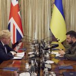 
              In this image provided by the Ukrainian Presidential Press Office, Ukrainian President Volodymyr Zelenskyy, right, and Britain's Prime Minister Boris Johnson speak, during their meeting in Kyiv, Ukraine, Saturday, April 9, 2022.  Johnson has traveled to Ukraine to meet with President Volodymyr Zelenskyy in show of solidarity. The two leaders meeting Saturday discussed the “U.K.’s long term support to Ukraine’’ including a new package of financial and military aid, the prime minister’s office said.  (Ukrainian Presidential Press Office via AP)
            
