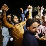 
              Supporters of Pakistani opposition parties reacts after Supreme Court decision, in Islamabad, Pakistan, Thursday, April 7, 2022. Pakistan's Supreme Court on Thursday ruled against Prime Minister Imran Khan, saying his move to dissolve Parliament and call early elections was illegal and ordering that the house be restored. (AP Photo/Anjum Naveed)
            