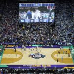 
              Kansas celebrates a victory over North Carolina during the second half of a college basketball game in the finals of the Men's Final Four NCAA tournament, Monday, April 4, 2022, in New Orleans. Kansas won 72-69. (AP Photo/David J. Phillip)
            