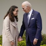 
              President Joe Biden talks with Mia Tretta, a survivor of the Saugus High School shooting in Santa Clarita, Calif., before she speaks in the Rose Garden of the White House in Washington, Monday, April 11, 2022. Biden announced a final version of the administration's ghost gun rule, which comes with the White House and the Justice Department under growing pressure to crack down on gun deaths. (AP Photo/Carolyn Kaster)
            