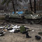 
              Military gear left by Russian soldiers are seen during a military sweep to search for possible remnants of Russian troops after their withdrawal from villages on the outskirts of Kyiv, Ukraine, Friday, April 1, 2022. (AP Photo/Rodrigo Abd)
            