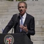 
              FILE - Los Angeles City Attorney Mike Feuer speaks at a news conference outside Los Angeles City Hall, March 7, 2022. Feuer, whose office can only file misdemeanor offenses, announced charges Friday, April 29, 2022 into a funeral home owner who illegally left the remains of 11 people, including infants, in stages of decay and mummification and faces more than a decade in jail, calling it an "incredibly sad and shocking situation" and said that officials could smell the odor from outside the San Fernando Valley facility. (AP Photo/Damian Dovarganes, File)
            