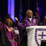 
              Bishop Anne Byfield, front right, President of the Council of Bishops, speaks during the opening worship service at the African Methodist Episcopal Church conference, July 6, 2021, in Orlando, Fla. Retired pastors have filed at least two federal lawsuits in recent weeks against the African Methodist Episcopal Church and several subsidiaries and financial firms the church used, claiming tens of millions of dollars from a pension fund were mismanaged and missing.(AP Photo/John Raoux, file)
            