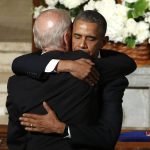 
              FILE - President Barack Obama hugs Vice President Joe Biden during funeral services for Biden's son, Beau Biden, June 6, 2015, at St. Anthony of Padua Church in Wilmington, Del. (Yuri Gripas/Pool Photo via AP, File)
            